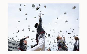 West Point graduating cadets throw their hats in the air in celebration at the conclusion of commencement ceremonies in West Point, N.Y., May 25, 2024. 