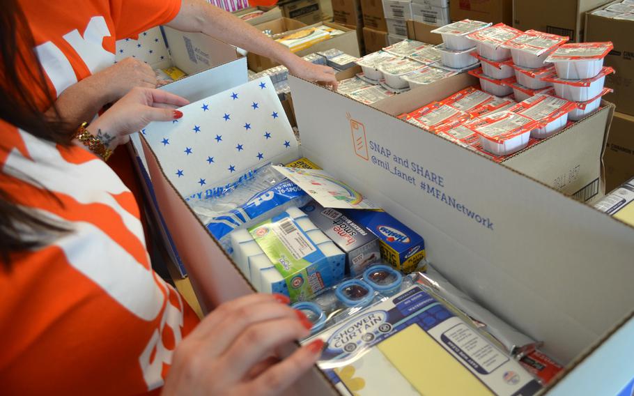 Volunteers in Texas on Wednesday, Sept. 11, 2024, fill 240 boxes with household essentials and food to give to military families who recently moved to Fort Cavazos. 