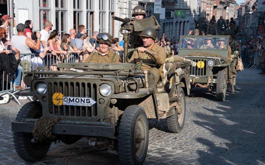 Reenactors drive World War II-era military vehicles through Mons, Belgium, on Sunday, Sept. 1, 2024, to commemorate the U.S. service members who liberated the city in 1944. The Tanks in Town event is held every year. Organizers say it’s the only event of its kind in the world. 