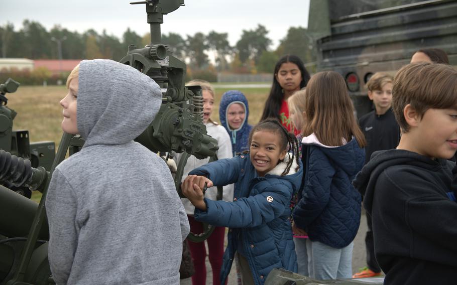 Students get a close-up look at a howitzer during STEM day at Grafenwoehr Elementary School.