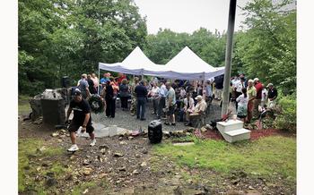 Nearly 100 people made their way up the side of Mount Tom to pay respects to the 25 servicemen killed when a B-17 crashed into he side of the mountain in 1946.