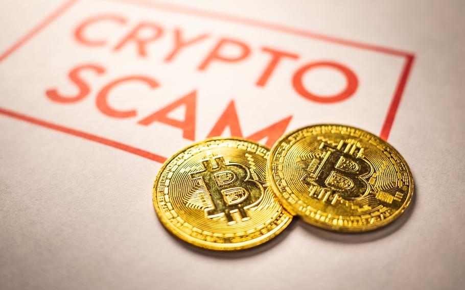 A photo of bitcoin on a manila folder that says crypto scam