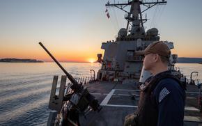 241003-N-AY869-1032 SOUDA BAY, Greece (Oct. 3, 2024) Culinary Specialist 2nd Class Heyang Sun stands small craft action team watch aboard the Arleigh Burke-class guided-missile destroyer USS Cole (DDG 67), Oct. 3. Cole is on a scheduled deployment in the U.S. Naval Forces Europe area of operations, employed by U.S. 6th Fleet to defend U.S., allied and partner interests. (U.S. Navy photo by Mass Communication Specialist Seaman Mark Peña