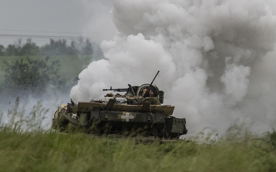 Ukraine soldiers from the 1st Tank Brigade operate a Soviet-era T-64 during practice maneuvers in the Zaporizhzhia region May 24, 2023.