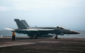 An F/A-18E Super Hornet prepares to launch  from the USS Theodore Roosevelt on July 31, 2024.