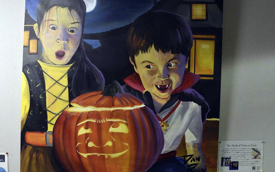 A painting of two children standing next to a jack-o-lantern.