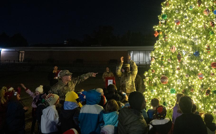 A crowd cheers the lighting of the Christmas tree at Robins Air Force Base.