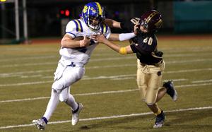 Yokota's Josh Low, stiff-arming Perry defender Aiden Ealey, accounted for 205 yards total offense for the Panthers.