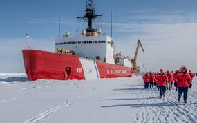 The crew of the USCGC Polar Star walks toward the Ross Ice Shelf in Antarctica on Feb. 3, 2024. 