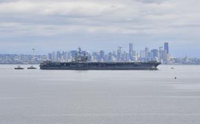 Nimitz-class aircraft carrier USS Ronald Reagan steams through the Puget Sound toward its new homeport Naval Base Kitsap in Bremerton, Wash., on Aug. 13, 2024. 