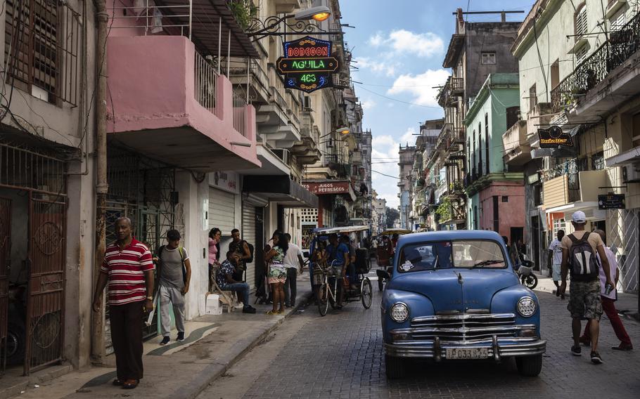 Classic American car makes its way down a street in Havana, Cuba, Nov. 11, 2023. 