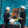 Sailors prepare to lay to rest the remains of former Navy junior officer Marc Rockwell-Pate, Sept. 30, 2024, during a burial at sea aboard the aircraft carrier USS Ronald Reagan while underway in the U.S. 3rd Fleet area of operations in the Pacific Ocean.