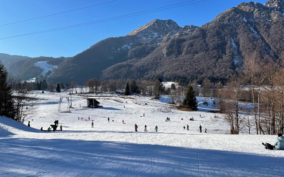 Visitors gather their sleds at the bottom of a hill in Piancavallo, Italy, on Dec. 31, 2024. The resort area in the Dolomite Mountains offers a range of winter recreation opportunities. 