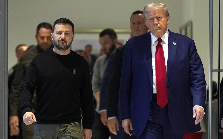 Donald Trump walks next to Volodymyr Zelenskyy.