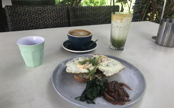 Eggs on toast with a flat white coffee and a green smoothie at Eva's Cafe in Darwin, Australia.  