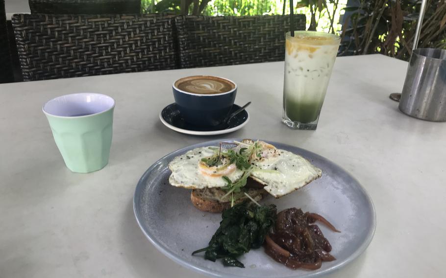 Eggs on toast with a flat white coffee and a green smoothie at Eva’s Cafe in Darwin, Australia.  