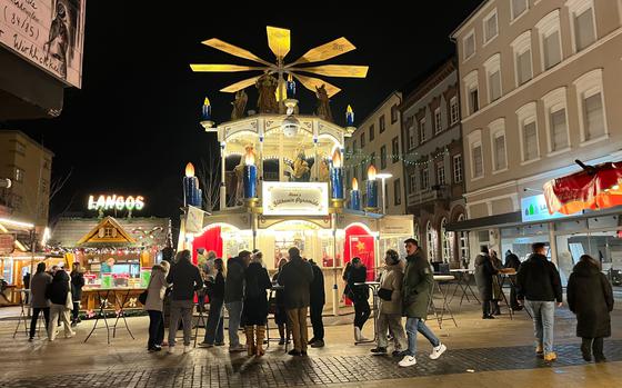 A stand shaped like a German Christmas decoration pyramid.