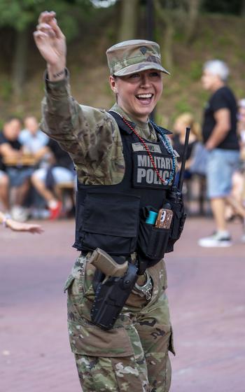 U.S. Army Spc. Kirsten Hanks, a military police officer assigned to the 317th Military Police Battalion, takes a quick dance break, during the inaugural Polish-American Freedom Fest, held at Powidz Lake, Poland, July 4, 2024. 