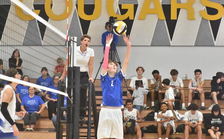 Sigonella’s Oscan Bentson sets the ball for a teammate during pool play Thursday, Oct. 26, 2023, in the DODEA-Europe boys volleyball championships.