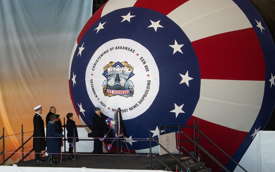 A view of the front of the submarine USS Arkansas, painted red, white and blue, during the christening ceremony.