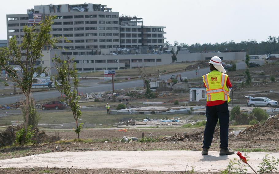 Bob Hill, a heavy mobile equipment mechanic with the U.S. Army Corps of Engineers’ Philadelphia District, surveys the tornado-stricken landscape of the city during a break in debris removal operations here July 24.