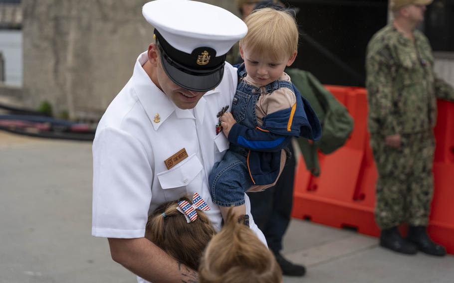 Chief Gas Turbine Systems Technician Thomas Midgette greets his family after the USS Leyte Gulf returned to Naval Station Norfolk on May 17, 2024, following its final deployment.