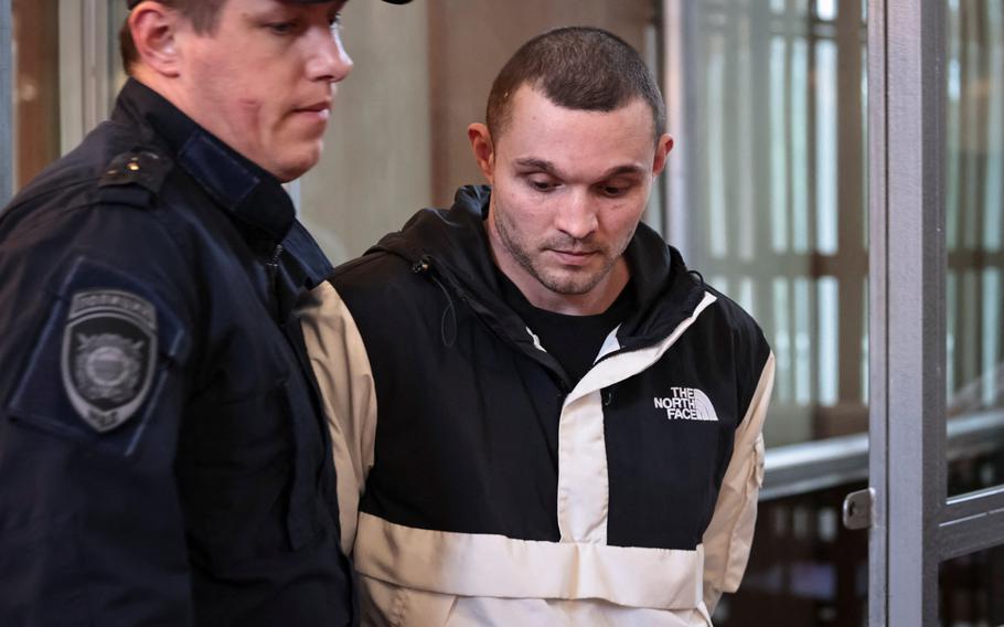 Gordon Black, a U.S. Army staff sergeant, who was detained in Russia on May 2 on suspicion of stealing from a woman he was in a relationship with, is escorted in a court during a hearing in Vladivostok, Russia, June 6, 2024.