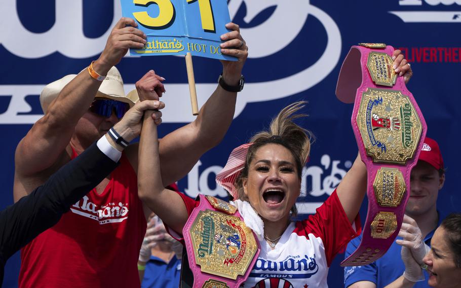 Miki Sudo celebrates after winning the women's competition at the Nathan's Famous Fourth of July hot dog eating contest at Coney Island.