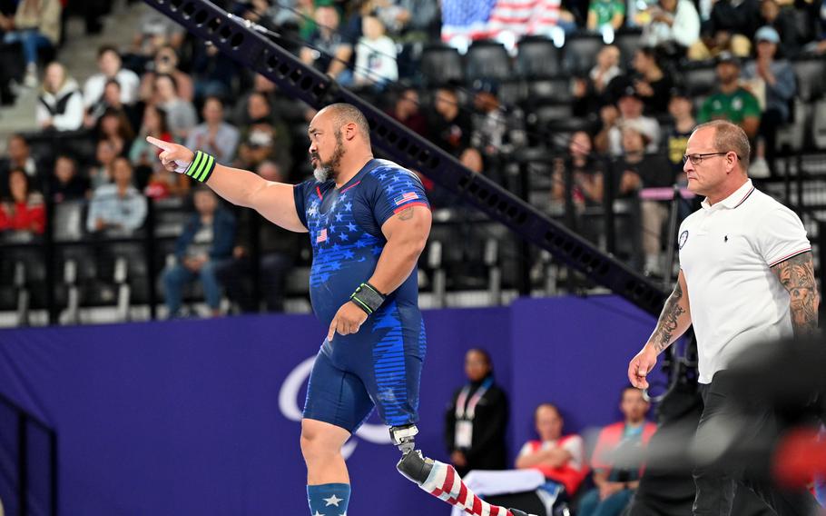 USA’s Bobby Body points to the American fans at the La Chapelle Arena as he approaches the platform at the para powerlifting competition at the 2024 Paris Paralympics. The Army veteran finished fourth in the up to 107 kilogram class, lifting 218 kilograms or 480.60 pounds.