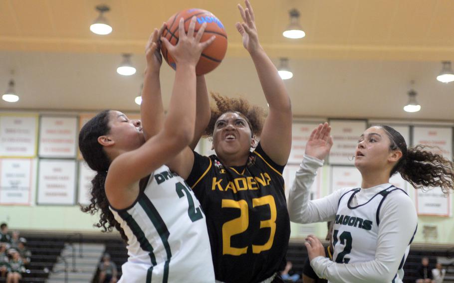 Reina Ohene battles Jayda Jefferson and Amaya Schaffeld for the ball.