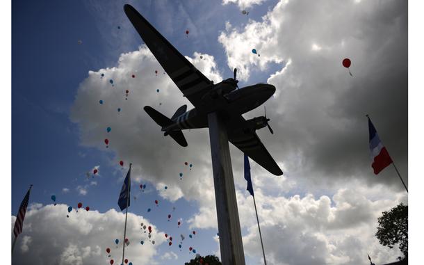 Picauville, France, June 5, 2014: Balloons carrying the names of  U.S. soldiers who died during the D-Day invasion were released at a 70th anniversary D-Day commemoration at the Ninth Air Force Memorial at Picauville, France, June 5, 2014.

"The clouds broke over the Channel, and suddenly there were more ships than you could see, with the white wakes of them streaming back to the English coast and the dark green of the Channel flat before them to the coast of Europe," wrote Stars and Stripes' Bud Hutton, who witnessed D-Day from a Ninth Air Force B-26 Marauder plane. Read his full account here.

META TAGS: DDay80; Invasion; World War II; WWII; D-Day; Ninth Air Force; Eight Air Force; bombers; 