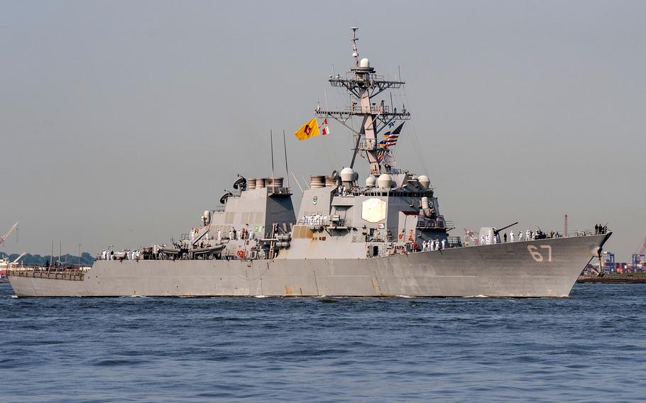 The destroyer USS Cole sails on the Hudson River in New York on May 24, 2023. The ship's commanding officer, Cmdr. Tim Clark, was transferred earlier this week to the aircraft carrier USS Theodore Roosevelt in the 5th Fleet's area of operations for undisclosed medical reasons, the Navy said.