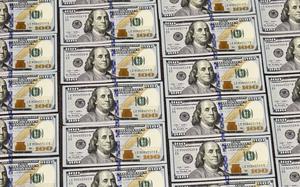 U.S. currency in one hundred dollar denominations are displayed for illustration purposes, in Washington, Monday, March 31, 2014. (AP Photo/J. Scott Applewhite)