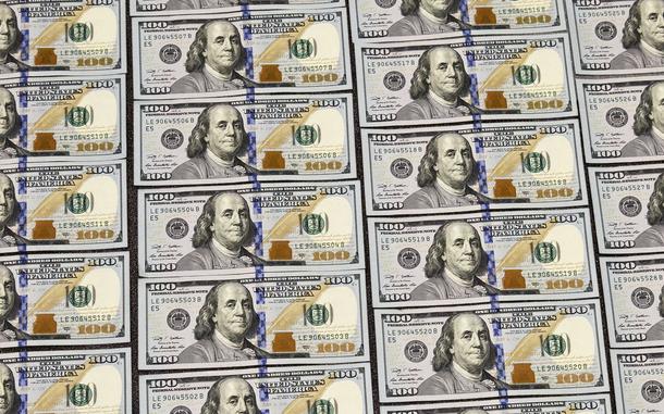 U.S. currency in one hundred dollar denominations are displayed for illustration purposes, in Washington, Monday, March 31, 2014. (AP Photo/J. Scott Applewhite)