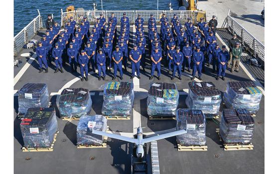 The crew poses with cocaine with a street value worth $182.8 million.