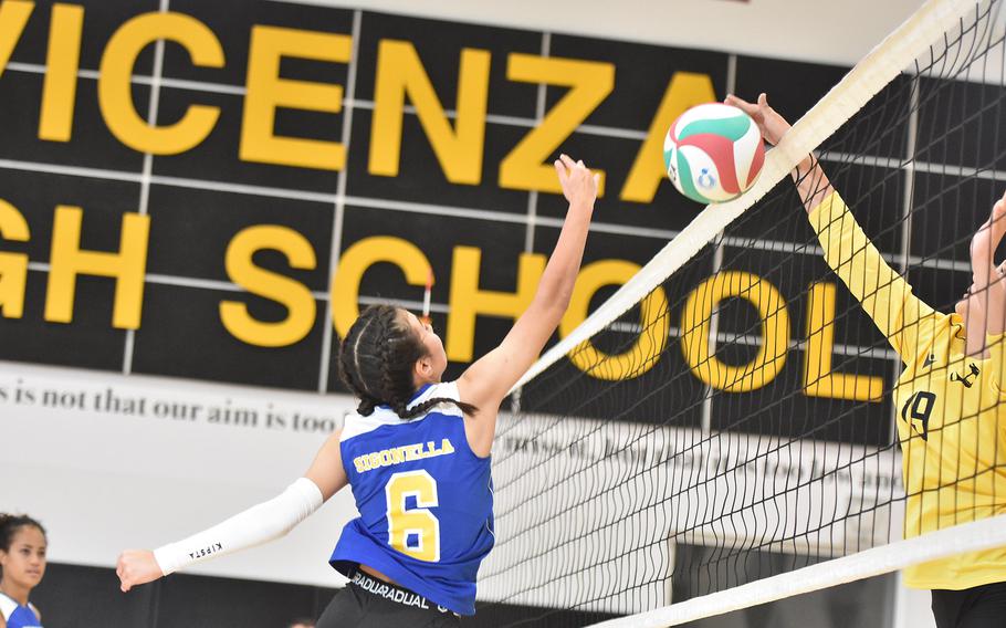 Vicenza's Emily Bell gets to the ball before Sigonella's Alexandra Quintanilla on Friday, Sept. 13, 2024, in the Cougars' victory over the Jaguars in Vicenza, Italy.