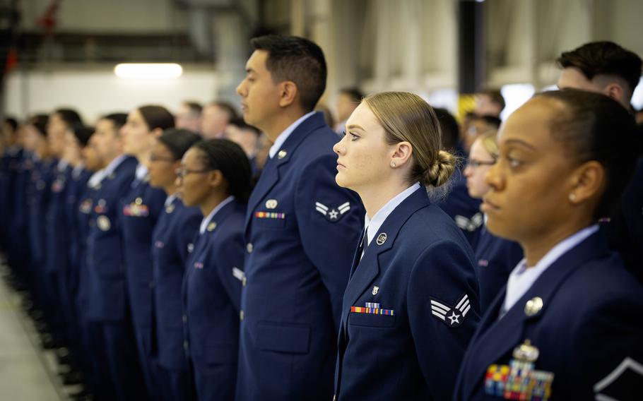 Airmen stand in formation while listening to Brig. Gen. Adrienne Williams during her first address to the troops at Ramstein Air Base, Germany, on May 17, 2024. Williams emphasized the wing's crucial role in rapid global mobility and sustainment operations in Europe and Africa.