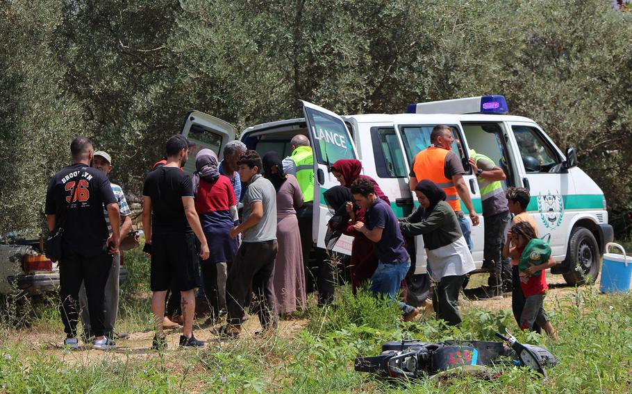 Rescuers evacuate injured Syrians living in makeshift tents in Lebanon, after the Israeli military targeted the area near the village of Burj al-Muluk, some 11 miles from the town of Nabatiyeh on July 20, 2024.