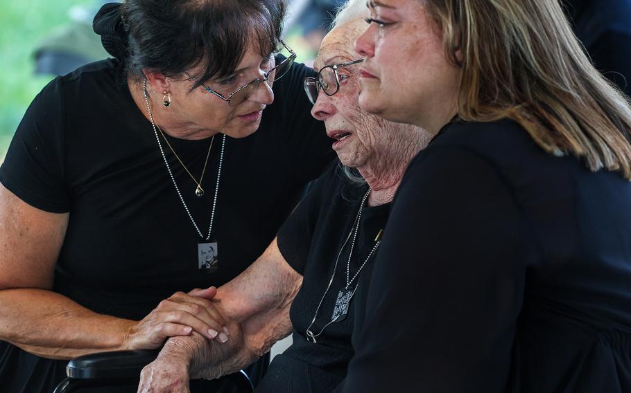 Mary Hambrock is comforted by her daughter Karla McCall