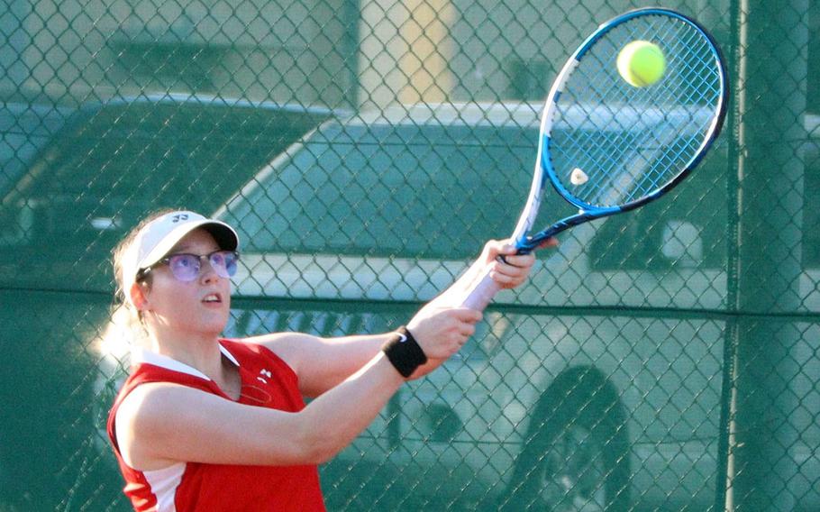 Nile C. Kinnick's Autumn Hendra returns against Christian Academy Japan's Riina Asakura during Wednesday's Kanto Plain tennis matches. Hendra won 8-0 and the Red Devils as a team won 3-2.