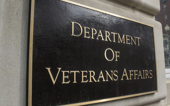 A brown sign with gold lettering outside the Department of Veterans Affairs in Washington.