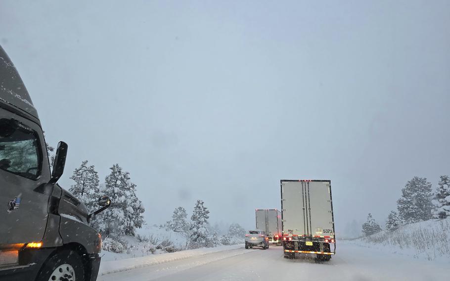 Traffic driving on a snow covered road