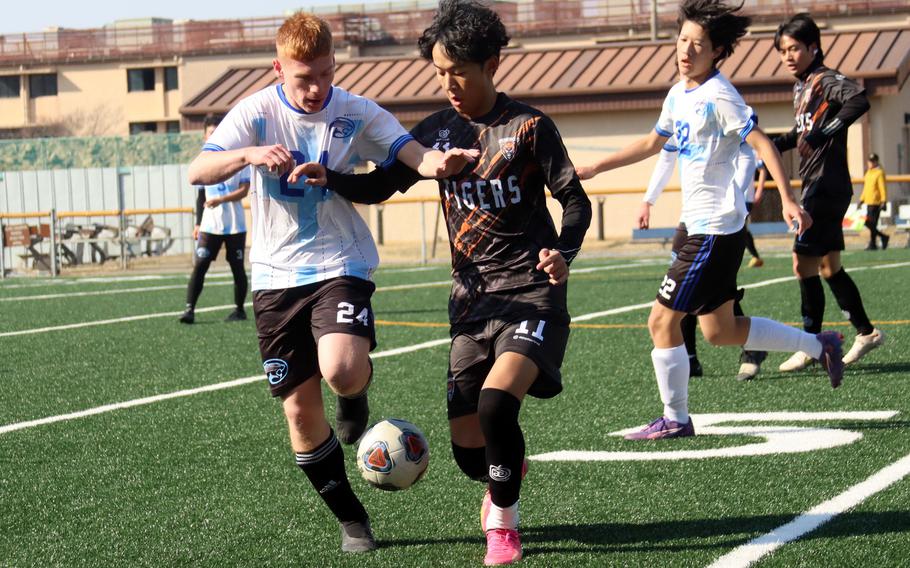 Lucas Harman tries to run the ball down.