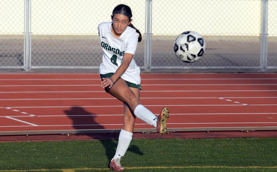 Sakura Lopez lofts the ball.