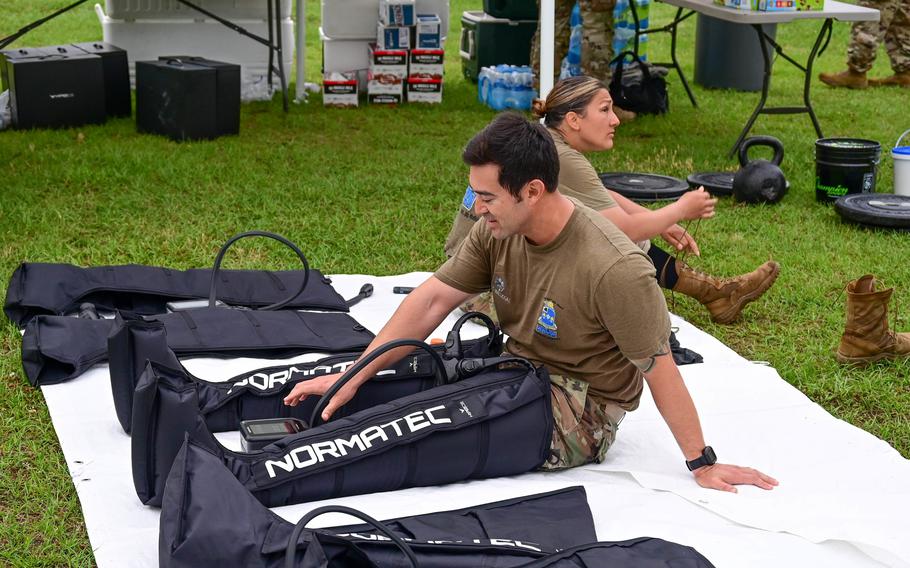 Service members use a leg compression machine after completing part of a fitness challenge in Columbia, S.C.