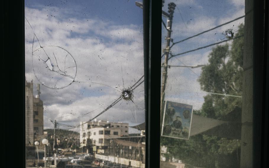 Bullet holes in the window of Jenin’s public hospital on Nov. 28, 2023. 