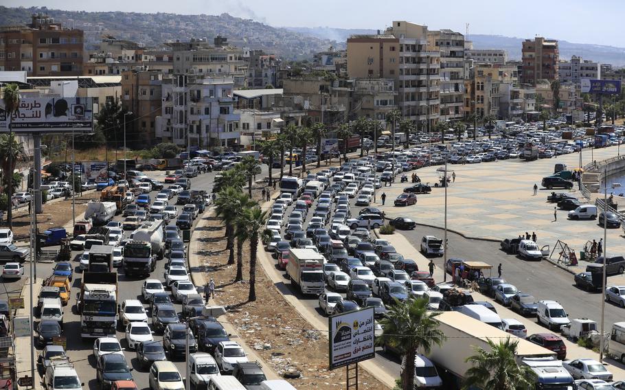 Cars sit in traffic as they flee the southern villages amid ongoing Israeli airstrikes, in Sidon, Lebanon.