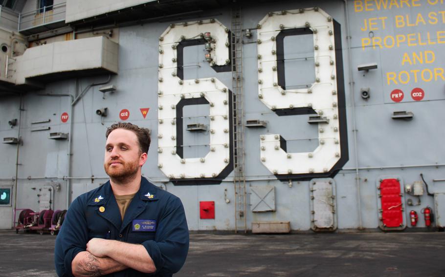 Petty Officer 1st Class Keith Woodcock, a quartermaster, poses for a portrait July 13, 2024, onboard the USS Dwight D. Eisenhower as the aircraft carrier transited the Atlantic Ocean 100 miles off the coast of Virginia. 