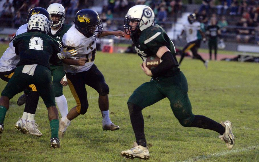 Lukas Gaines runs with the football.