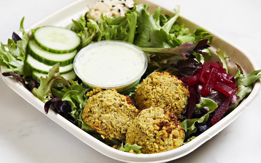 The new Mediterranean salad with falafel, hummus, pickled beets, cucumber, greens and green goddess dressing. 